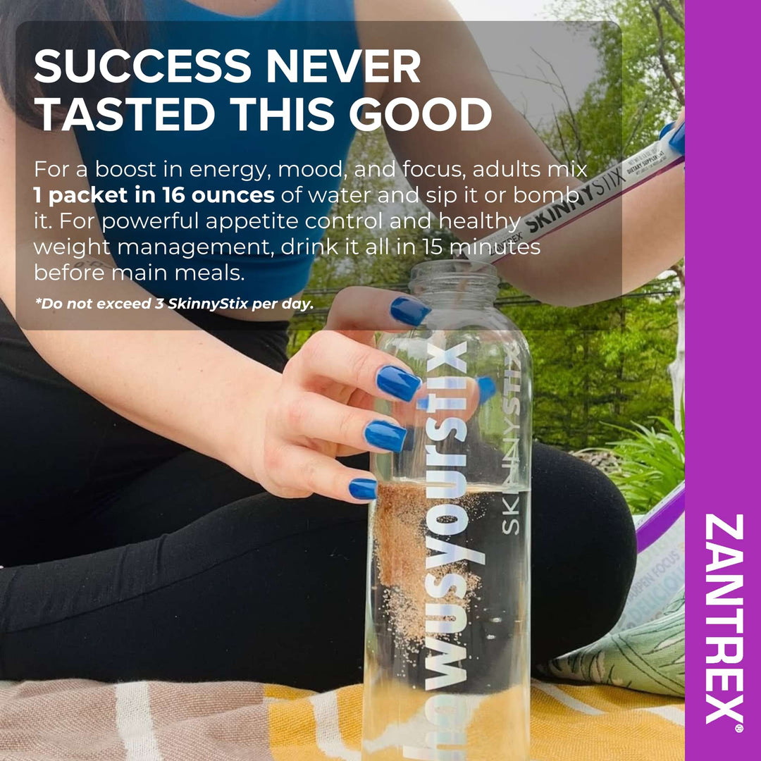 Person holding a clear bottle with a Zantrex SkinnyStix product, sitting outdoors.