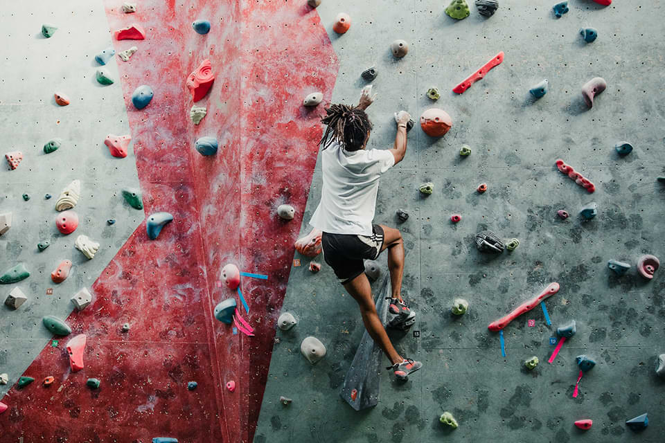 Man on a rock climbing wall.